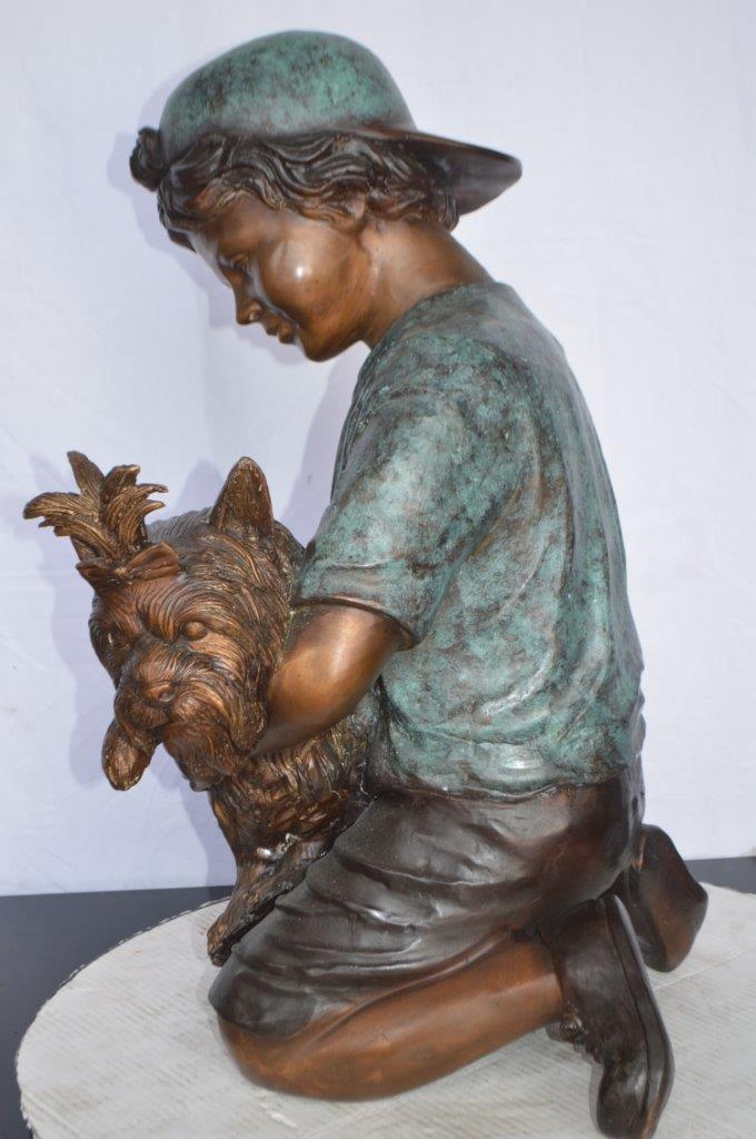 Young Child Playing With His Dog Bronze Statue -  Size: 18"L x 17"W x 26"H.
