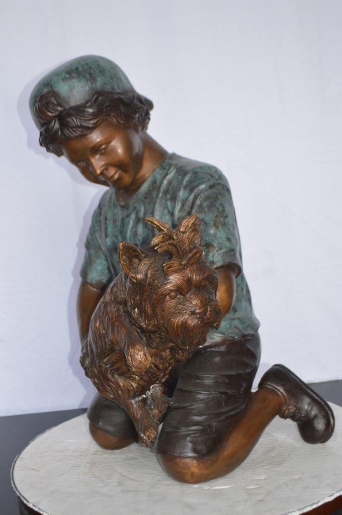 Young Child Playing With His Dog Bronze Statue -  Size: 18"L x 17"W x 26"H.