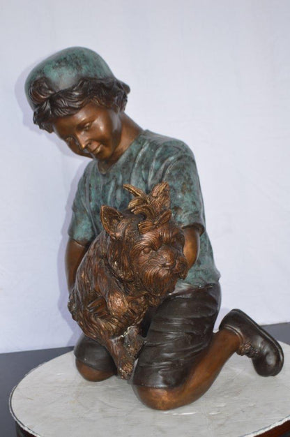 Young Child Playing With His Dog Bronze Statue -  Size: 18"L x 17"W x 26"H.