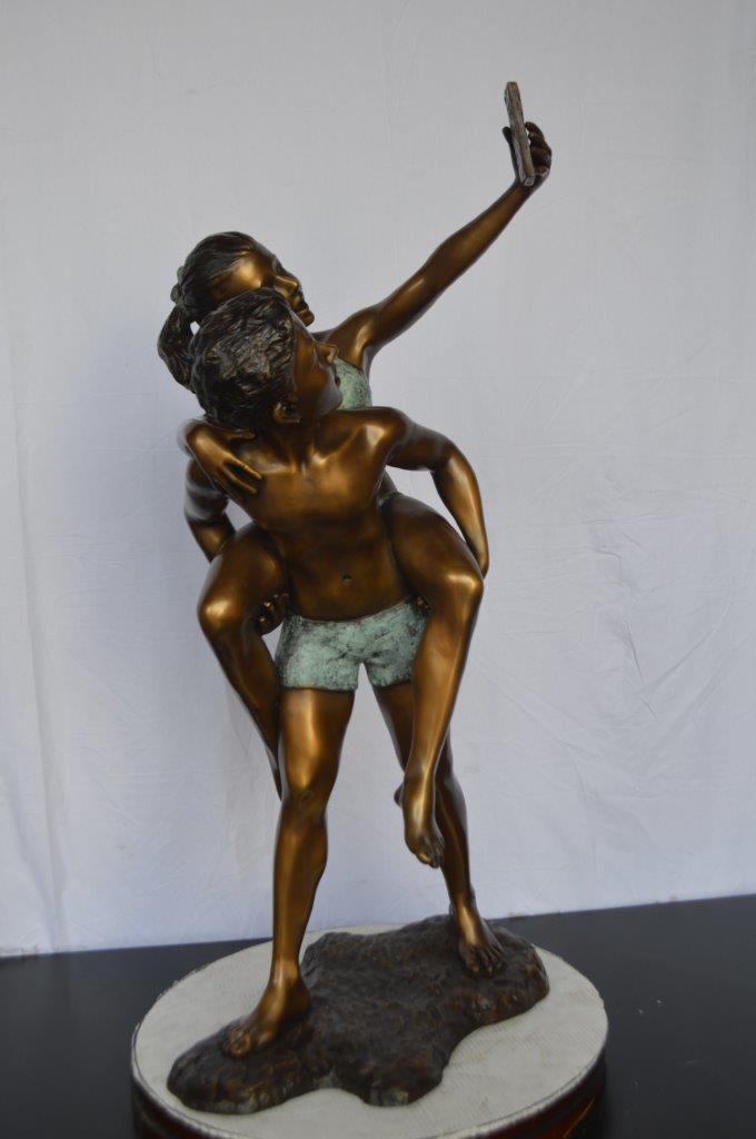 Kids Taking a Selfie W a Smartphone Bronze Statue -  Size: 23"L x 20"W x 43"H.
