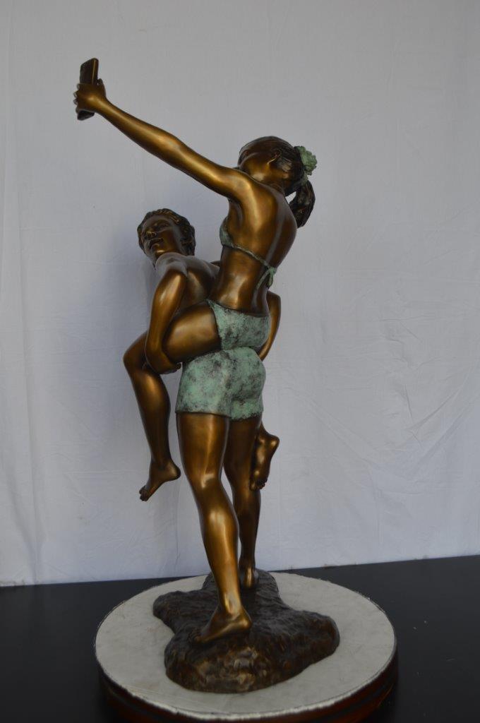 Kids Taking a Selfie W a Smartphone Bronze Statue -  Size: 23"L x 20"W x 43"H.