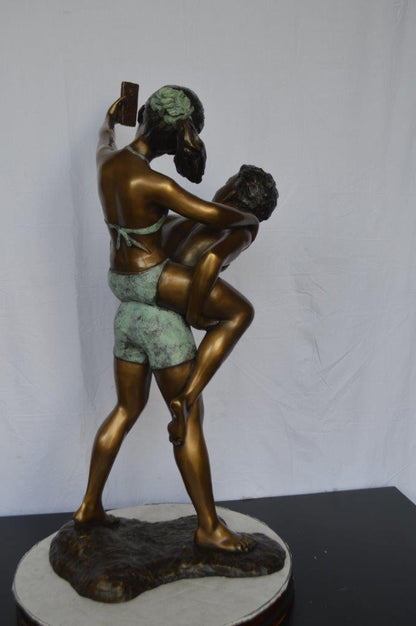 Kids Taking a Selfie W a Smartphone Bronze Statue -  Size: 23"L x 20"W x 43"H.