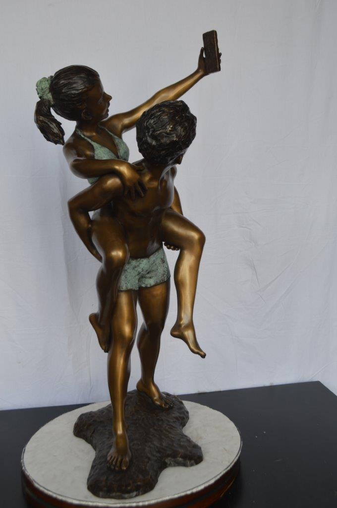 Kids Taking a Selfie W a Smartphone Bronze Statue -  Size: 23"L x 20"W x 43"H.