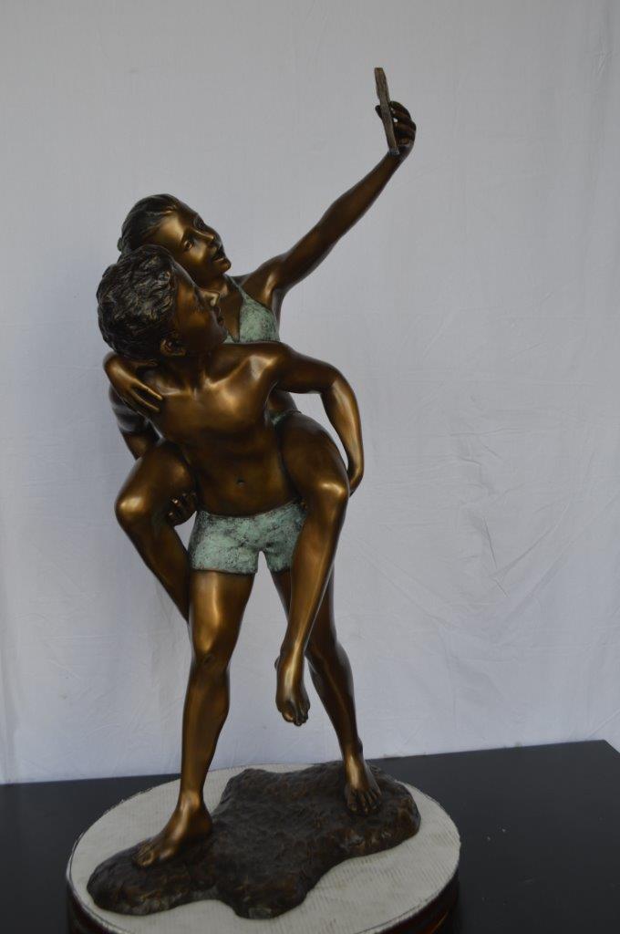 Kids Taking a Selfie W a Smartphone Bronze Statue -  Size: 23"L x 20"W x 43"H.