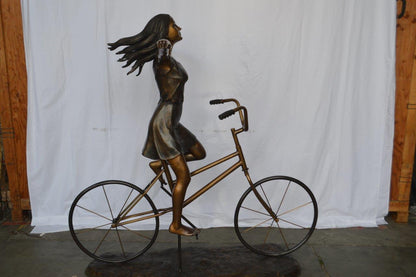 Girl Riding Hands Free life Size Bronze Statue -  Size: 53"L x 62"W x 61"H.