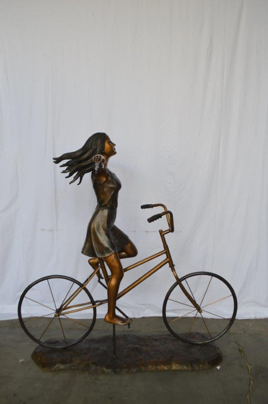 Girl Riding Hands Free life Size Bronze Statue -  Size: 53"L x 62"W x 61"H.