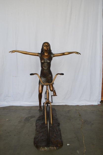 Girl Riding Hands Free life Size Bronze Statue -  Size: 53"L x 62"W x 61"H.