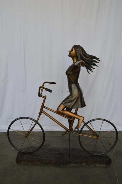Girl Riding Hands Free life Size Bronze Statue -  Size: 53"L x 62"W x 61"H.