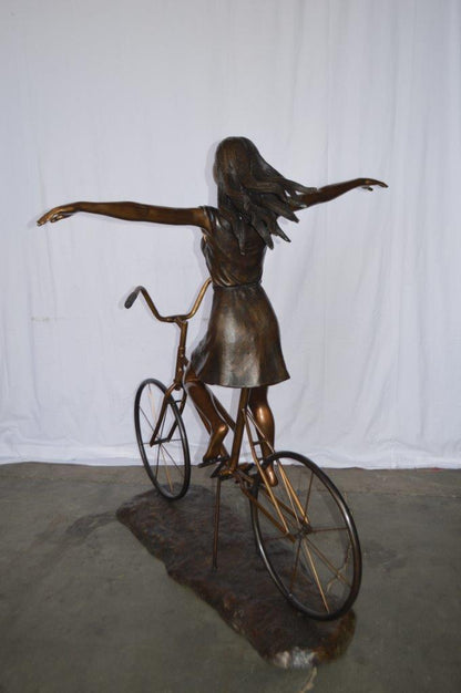 Girl Riding Hands Free life Size Bronze Statue -  Size: 53"L x 62"W x 61"H.