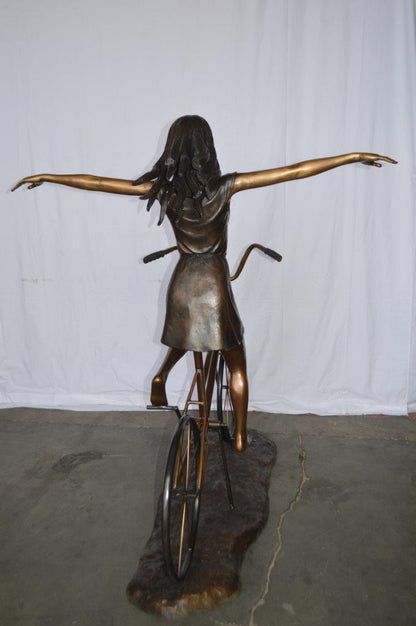 Girl Riding Hands Free life Size Bronze Statue -  Size: 53"L x 62"W x 61"H.