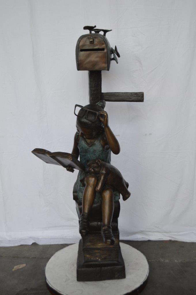 Mailbox - Girl sitting on books and reading -  Size: 26"L x 22"W x 53"H.