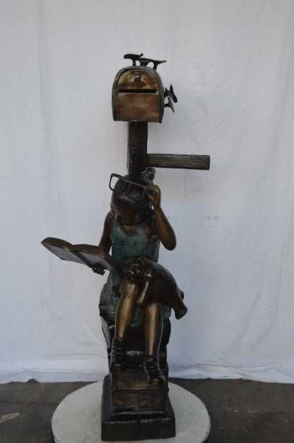 Mailbox - Girl sitting on books and reading -  Size: 26"L x 22"W x 53"H.
