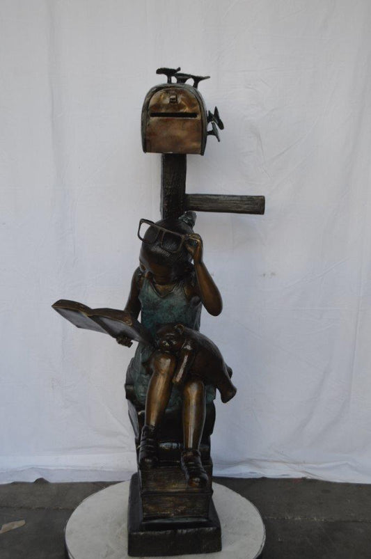 Mailbox - Girl sitting on books and reading -  Size: 26"L x 22"W x 53"H.