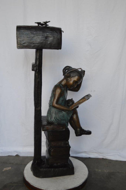 Mailbox - Girl sitting on books and reading -  Size: 26"L x 22"W x 53"H.