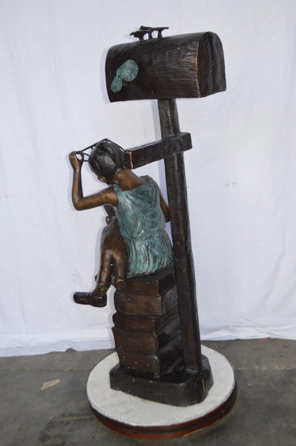 Mailbox - Girl sitting on books and reading -  Size: 26"L x 22"W x 53"H.