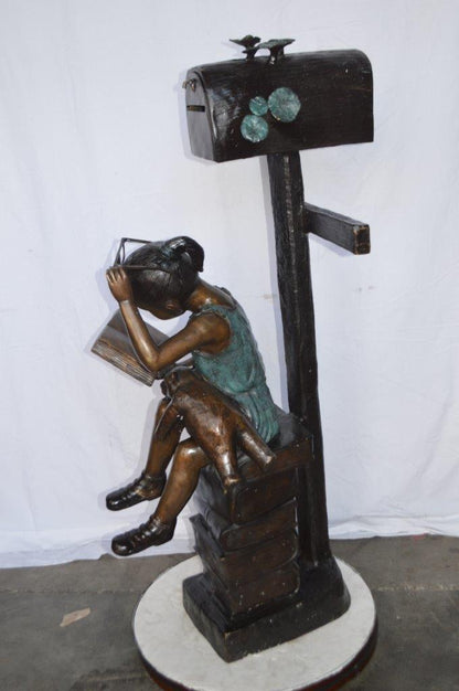 Mailbox - Girl sitting on books and reading -  Size: 26"L x 22"W x 53"H.