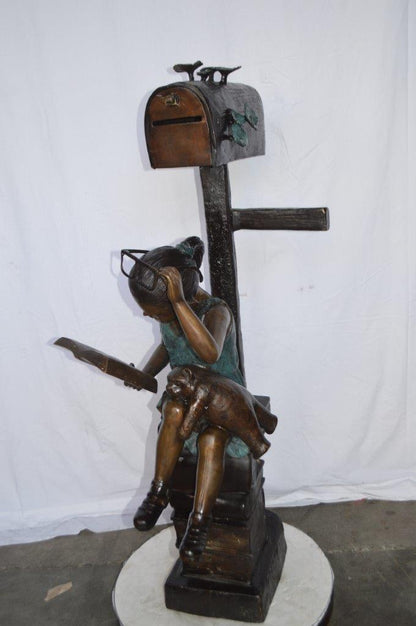 Mailbox - Girl sitting on books and reading -  Size: 26"L x 22"W x 53"H.