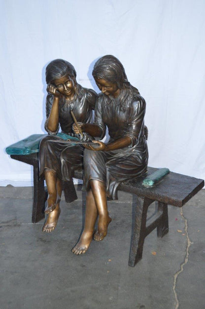 Two Schoolgirls Sitting On a Bench Bronze Statue -  Size: 45"L x 24"W x 41"H.