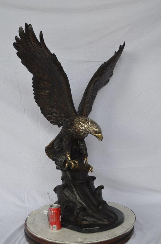Eagle perched bronze statue -  Size: 28"L x 18"W x 41"H.