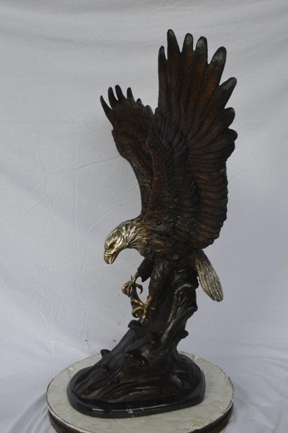 Eagle perched bronze statue -  Size: 28"L x 18"W x 41"H.