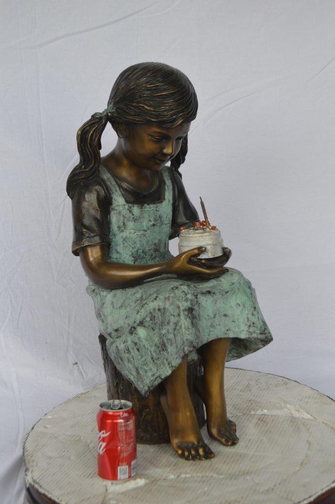 Girl with birthday cake bronze statue -  Size: 13"L x 10"W x 27"H.