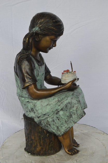 Girl with birthday cake bronze statue -  Size: 13"L x 10"W x 27"H.
