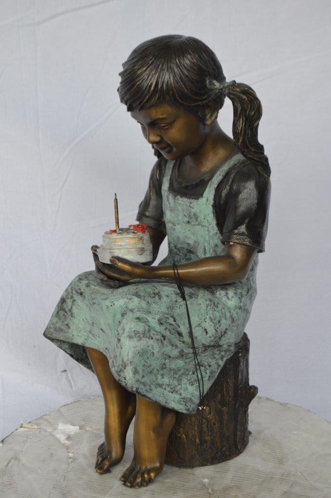 Girl with birthday cake bronze statue -  Size: 13"L x 10"W x 27"H.
