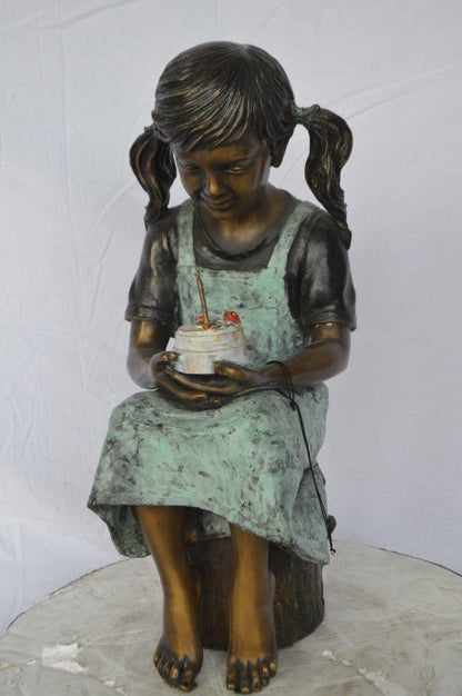 Girl with birthday cake bronze statue -  Size: 13"L x 10"W x 27"H.