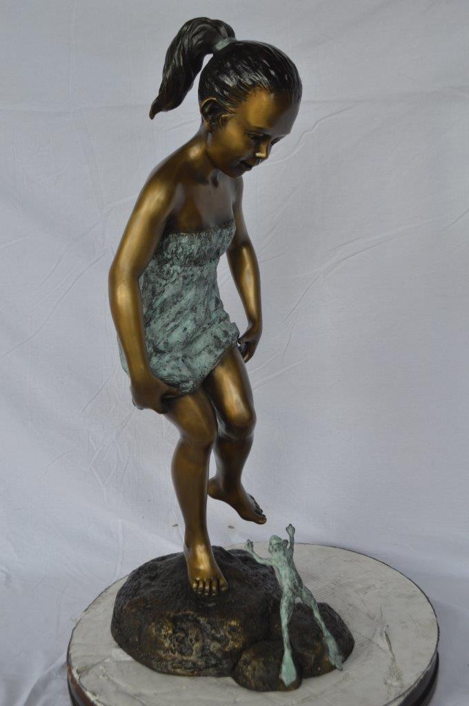 Girl looking at a frog bronze statue -  Size: 16"L x 13"W x 36"H.