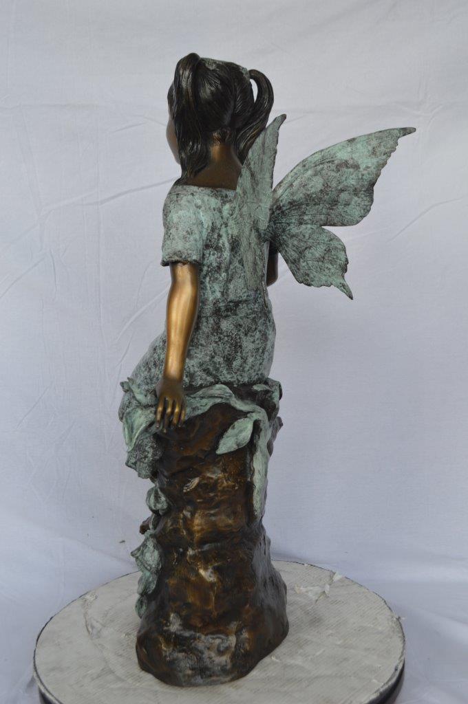 Angel girl sitting with a rose bronze statue -  Size: 22"L x 27"W x 37"H.