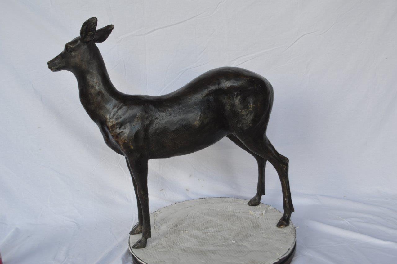 Doe - baby deer bronze statue -  Size: 30"L x 8"W x 30"H.