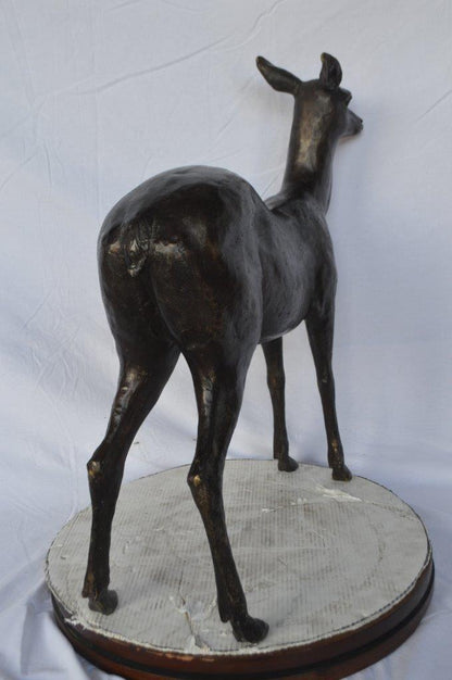 Doe - baby deer bronze statue -  Size: 30"L x 8"W x 30"H.