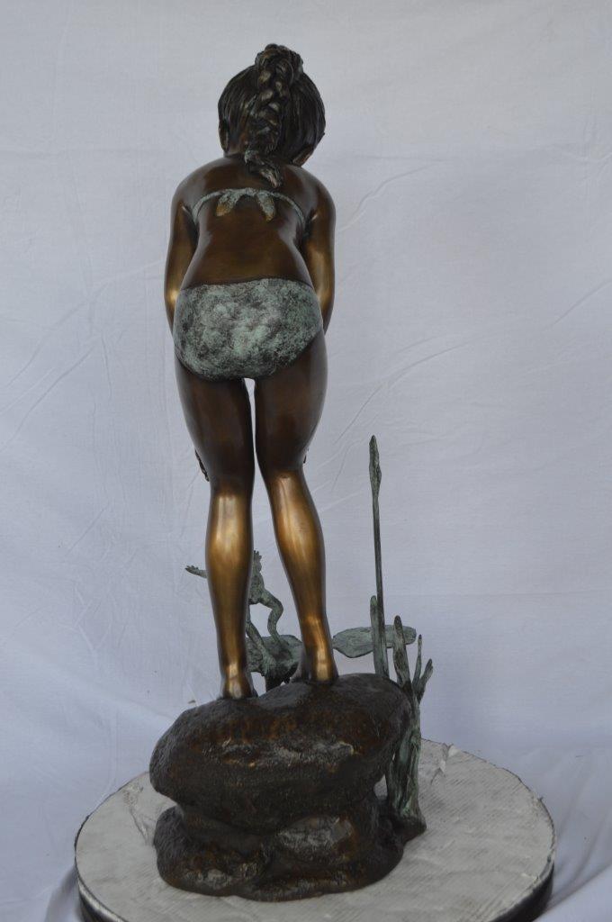 Girl looking at frog jumping bronze fountain -  Size: 21"L x 15"W x 38"H.