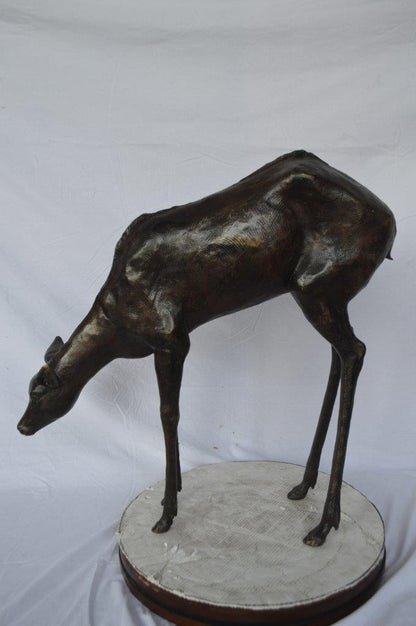Life Size deer bronze statue -  Size: 33"L x 9"W x 34"H.