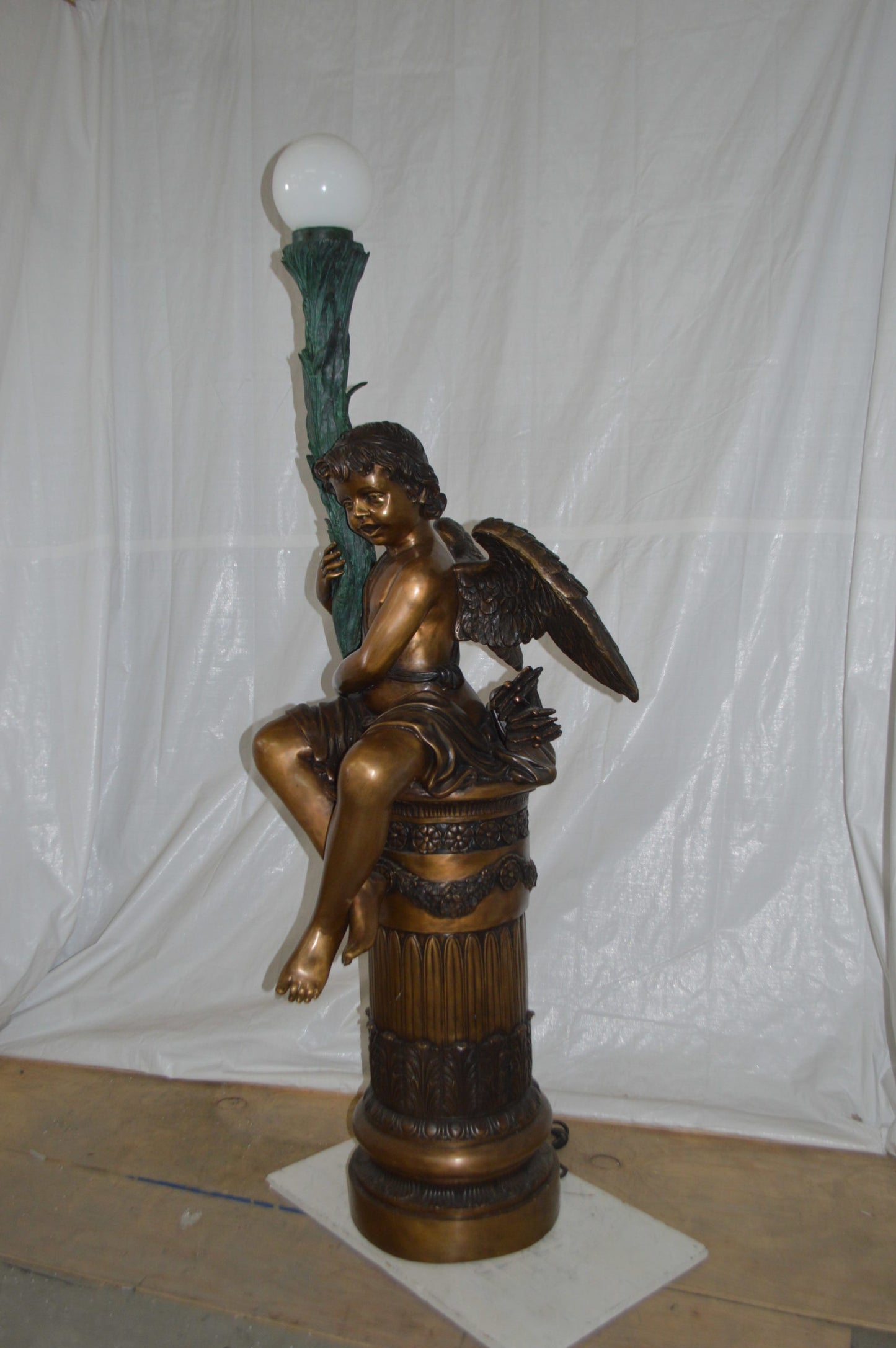Pair of Cupid on stand lamp -  Size: 28"L x 24"W x 90"H.