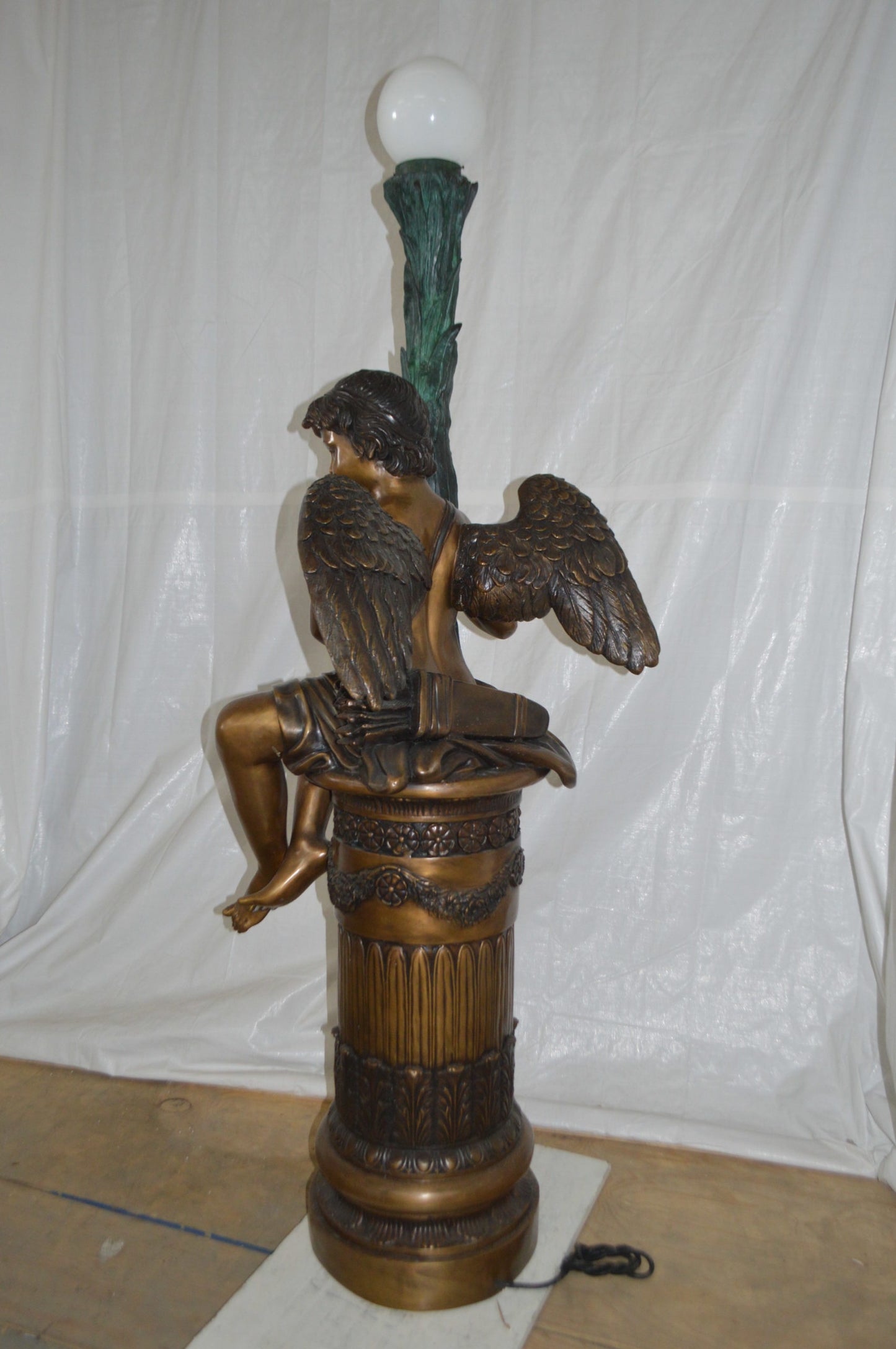 Pair of Cupid on stand lamp -  Size: 28"L x 24"W x 90"H.
