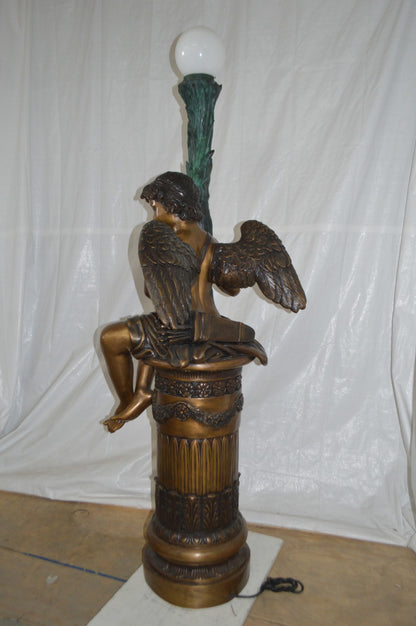 Pair of Cupid on stand lamp -  Size: 28"L x 24"W x 90"H.