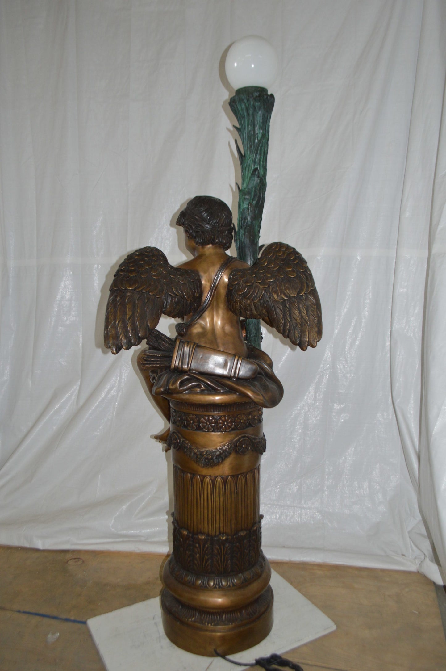 Pair of Cupid on stand lamp -  Size: 28"L x 24"W x 90"H.