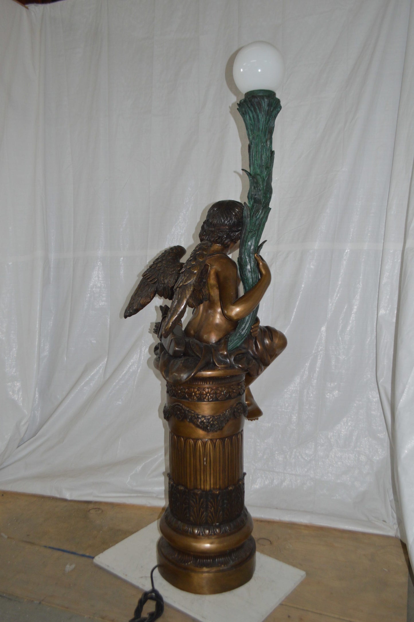 Pair of Cupid on stand lamp -  Size: 28"L x 24"W x 90"H.