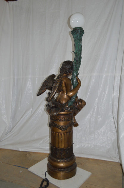 Pair of Cupid on stand lamp -  Size: 28"L x 24"W x 90"H.