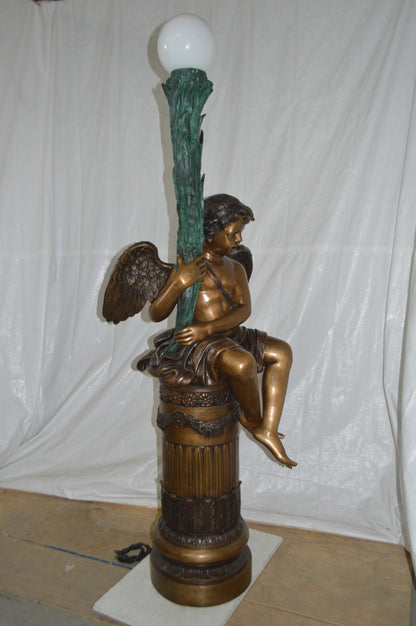 Pair of Cupid on stand lamp -  Size: 28"L x 24"W x 90"H.