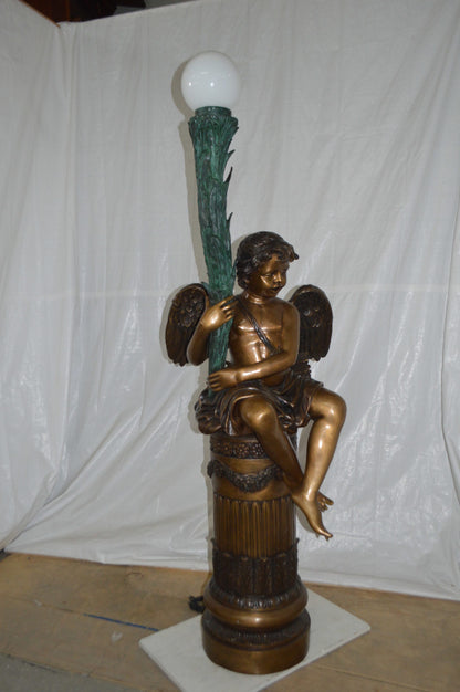 Pair of Cupid on stand lamp -  Size: 28"L x 24"W x 90"H.