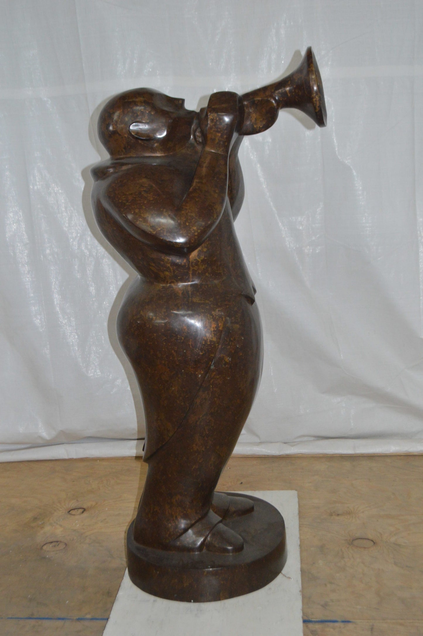Musician playing the trumpet bronze statue -  Size: 24"L x 20"W x 56"H.