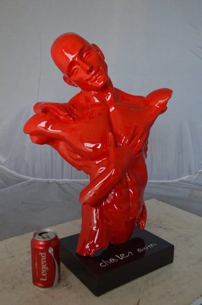 Modern resin statue of a man hugged by a woman -  Size: 17"L x 8"W x 24"H.