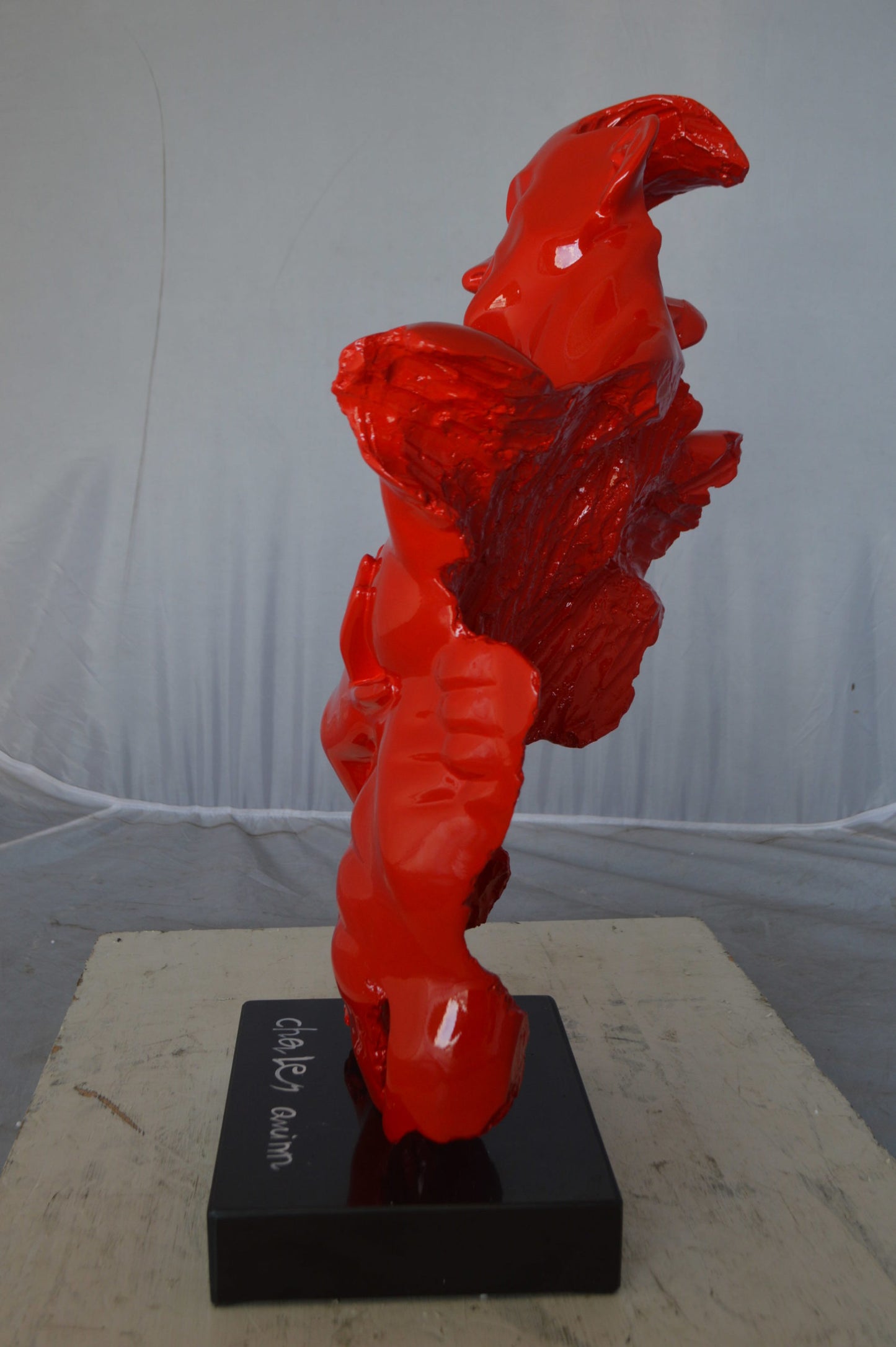 Modern resin statue of a man hugged by a woman -  Size: 17"L x 8"W x 24"H.