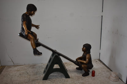Playful Children on a See-Saw Bronze Statue Size: 76" x 27" x 59"H