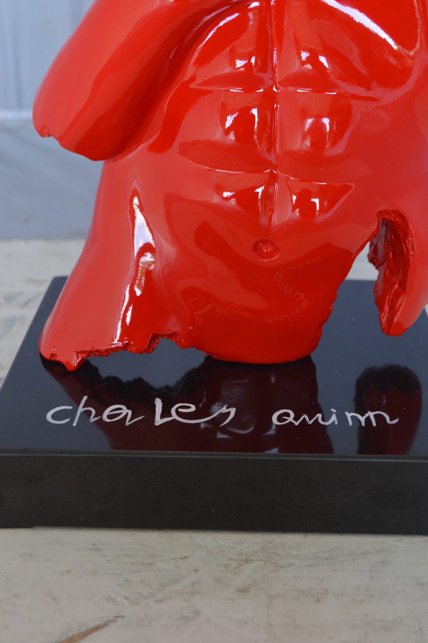 Modern resin statue of a man hugged by a woman -  Size: 17"L x 8"W x 24"H.