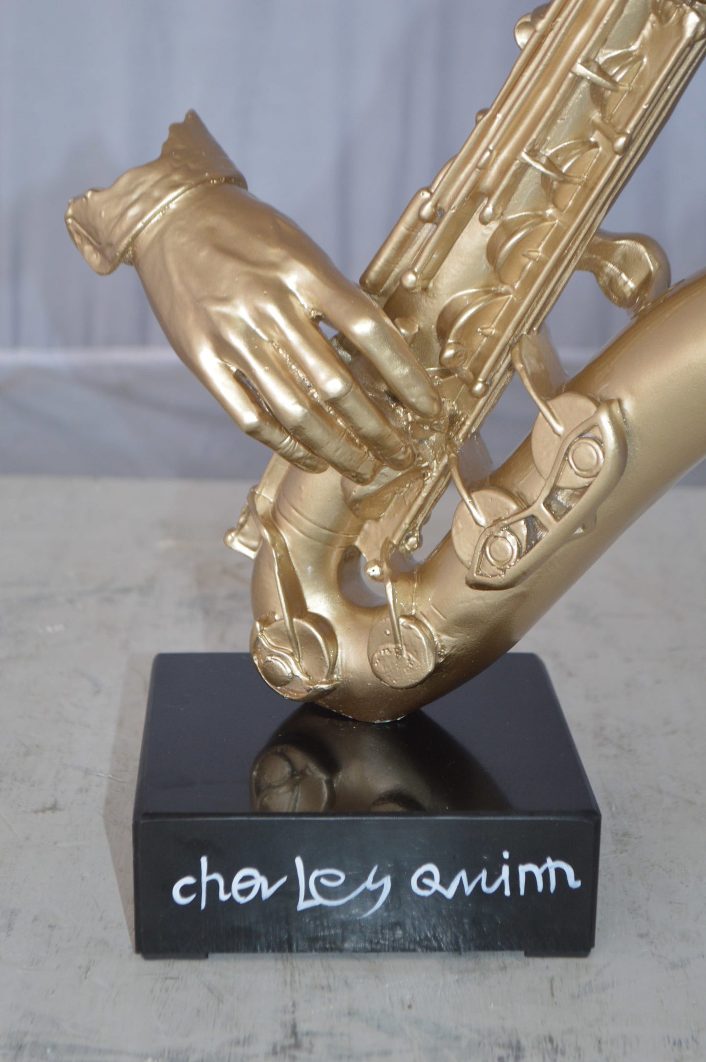 Modern art of a saxophone player resin statue -  Size: 13"L x 5"W x 25"H.