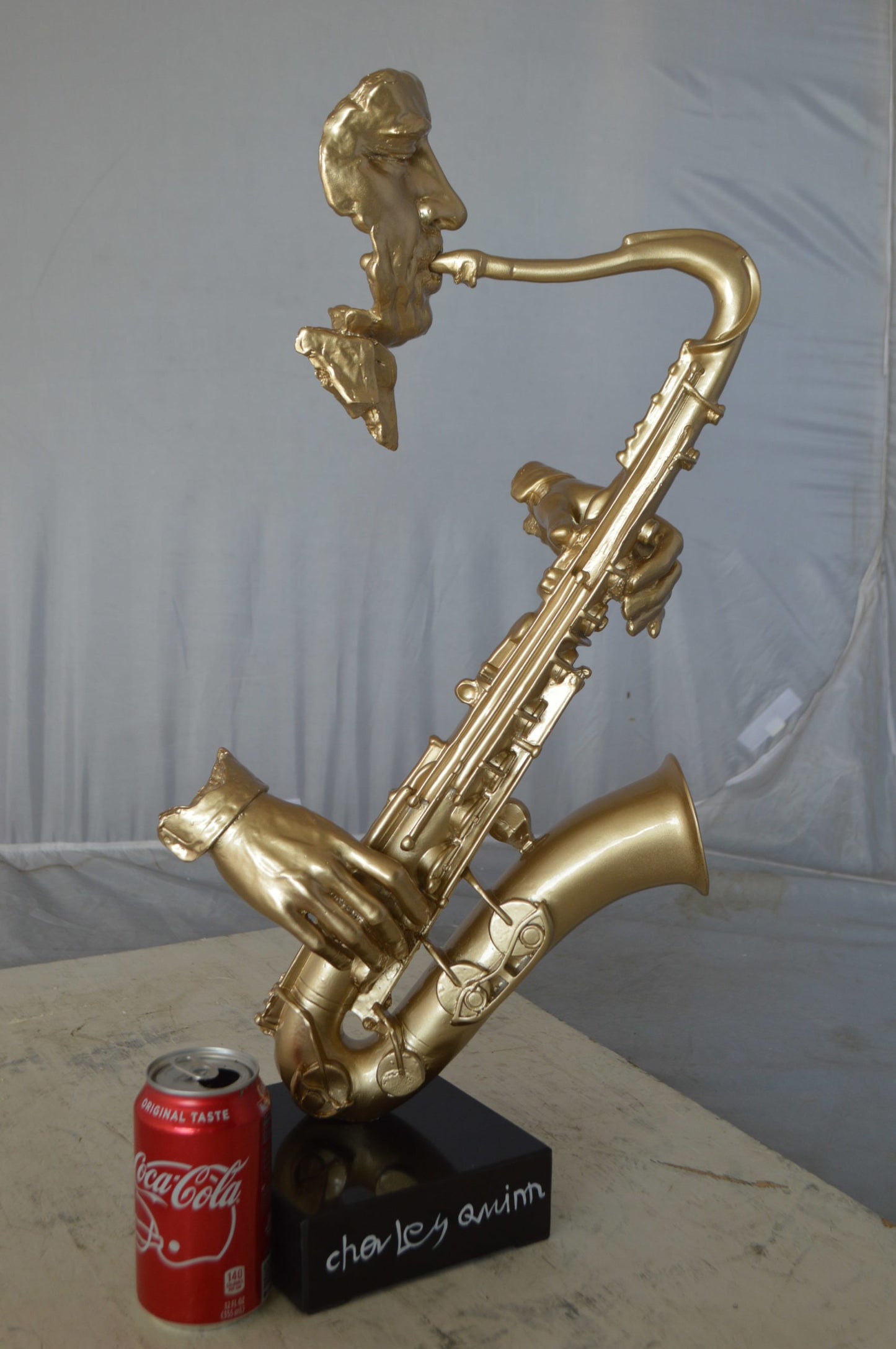 Modern art of a saxophone player resin statue -  Size: 13"L x 5"W x 25"H.