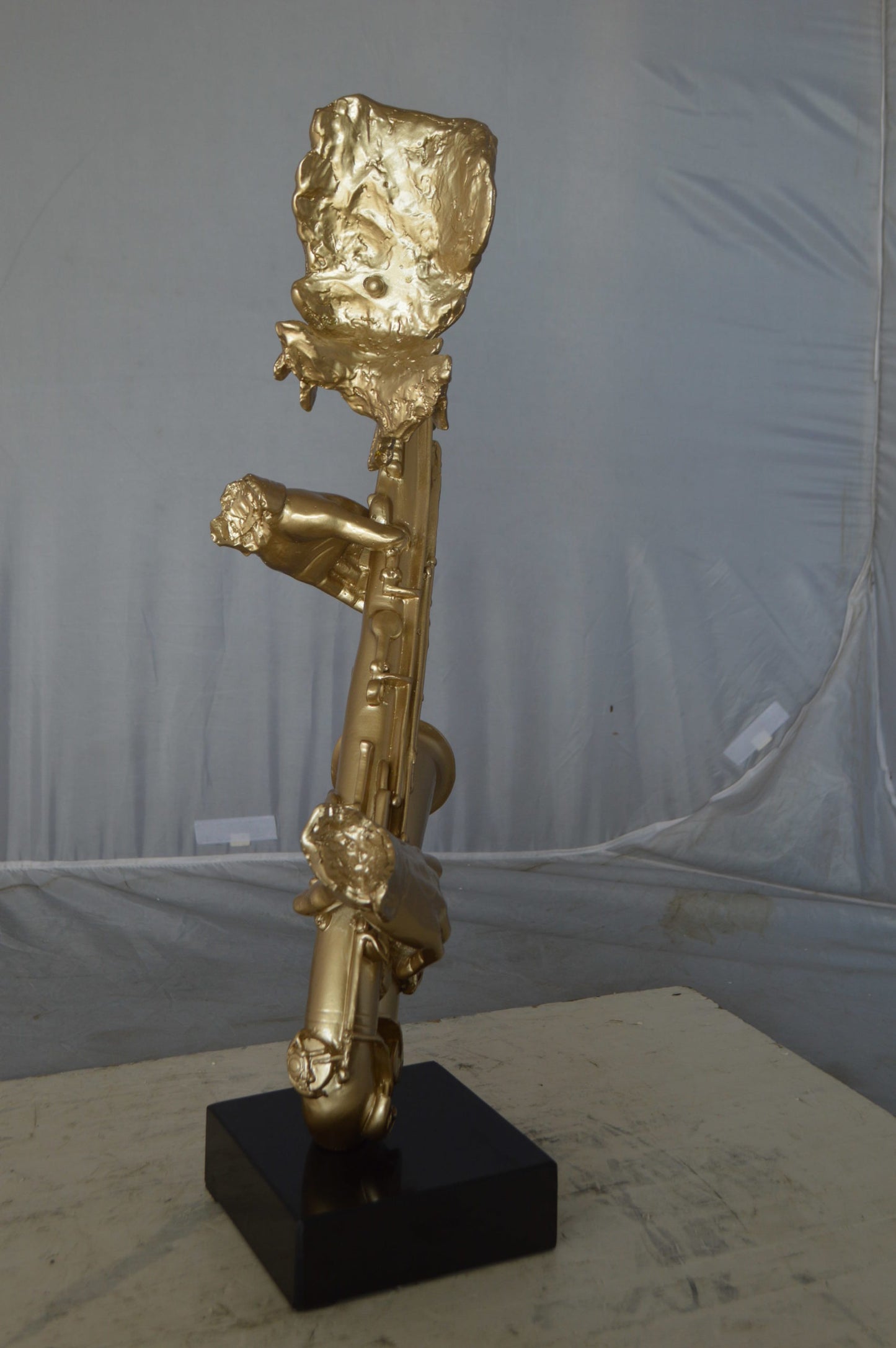 Modern art of a saxophone player resin statue -  Size: 13"L x 5"W x 25"H.